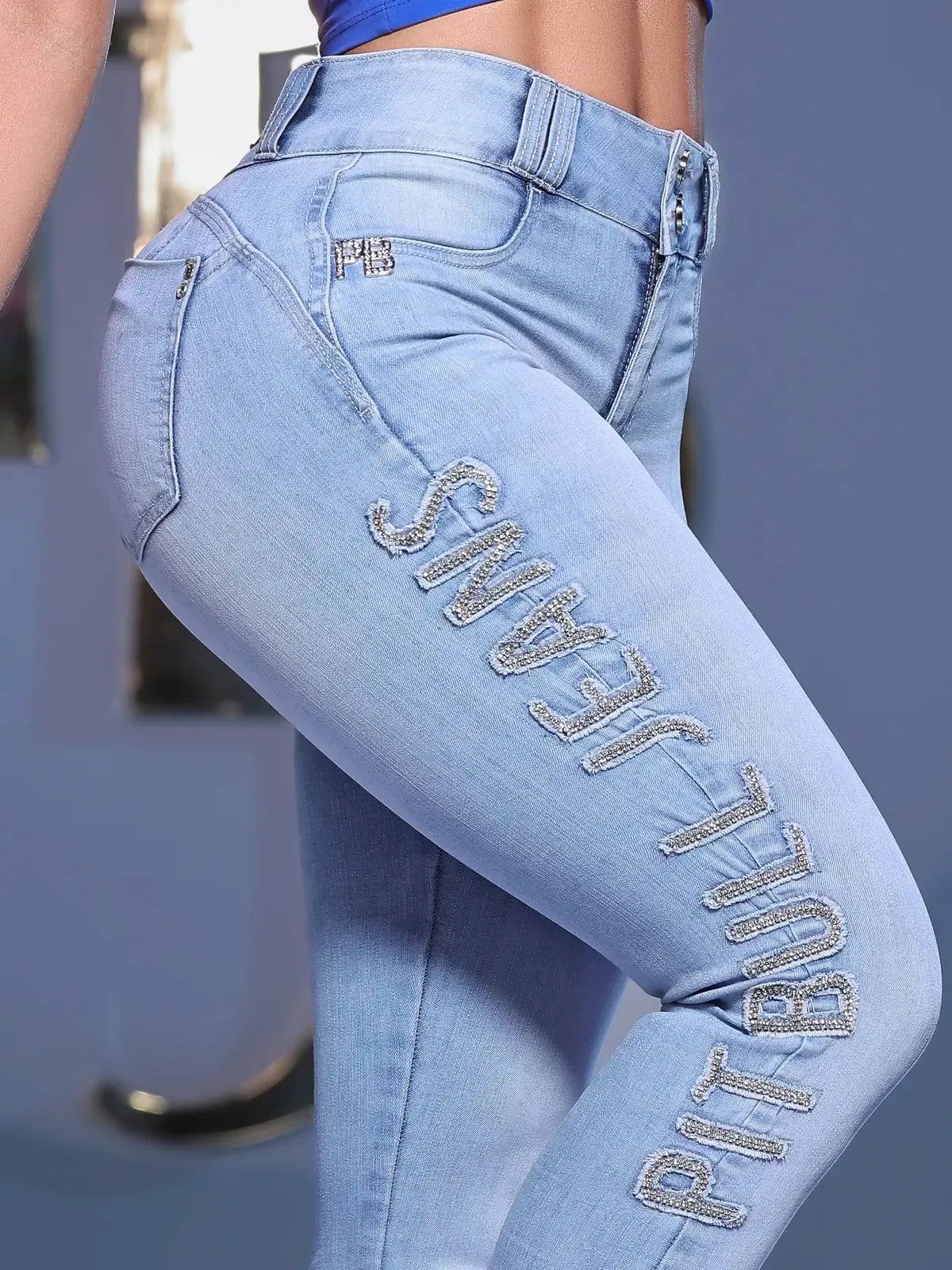 CALÇA SKINNY LOGOMANIA CÓS ALTO COM BORDADO LATERAL